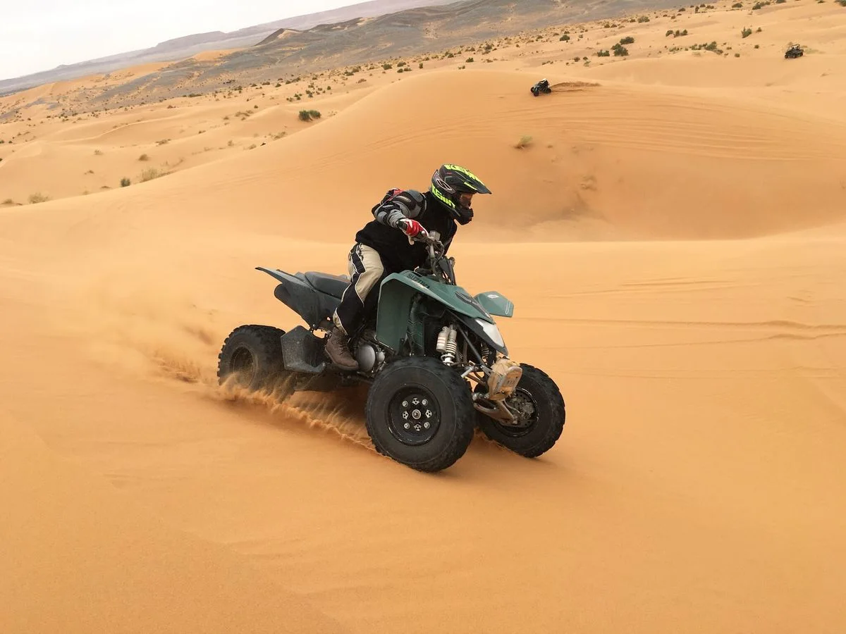 Quad bike riding on Dubai red dunes
